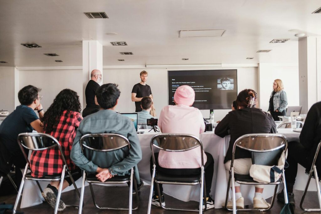 A group of people sitting at tables in a room