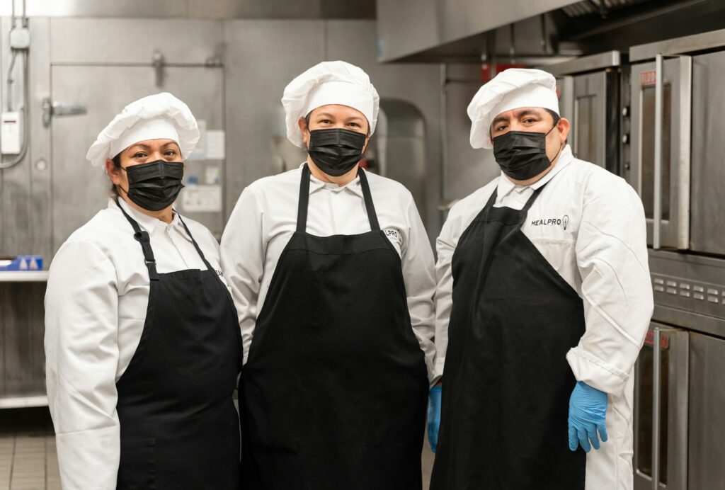 2 men in white chef uniform standing